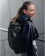 Db Journey The Hugger Backpack - Durable Travel Backpack with Laptop Compartment & Pockets for Work, Luggage Backpack with Roller Bag Hook Up System, 20L - Blackout