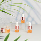 100 Pcs Mini Glass Oil Dropper Bottle Bulk, Clear Essential Small Empty Bottles Sample Containers Perfume Liquid Vials with Cap for Traveling (1 ml,Rose Gold)