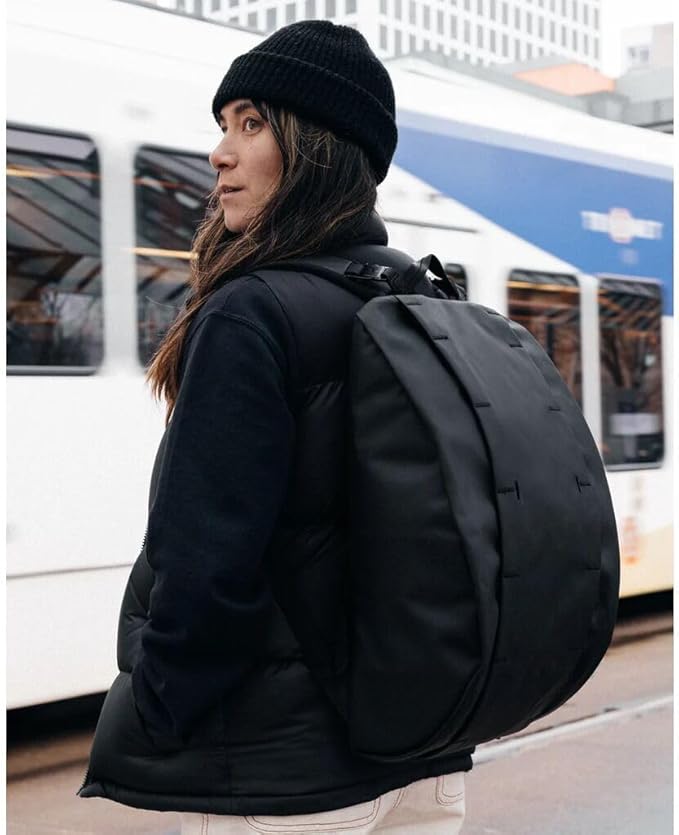 Db Journey The Hugger Backpack - Durable Travel Backpack with Laptop Compartment & Pockets for Work, Luggage Backpack with Roller Bag Hook Up System, 15L - Blackout