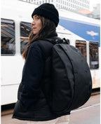 Db Journey The Hugger Backpack - Durable Travel Backpack with Laptop Compartment & Pockets for Work, Luggage Backpack with Roller Bag Hook Up System, 15L - Blackout