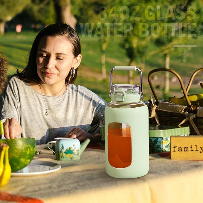 BLUEGO 84oz Water Bottle Glass with Stainless Steel Handle Large 2.5l Water Bottle with Time Markers and Silicone Sleeve Half Gallon Water Jug BPA Free for Gym Daily Use, Light Green