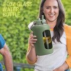 BLUEGO 84oz Water Bottle Glass with Stainless Steel Handle Large 2.5l Water Bottle with Time Markers and Silicone Sleeve Half Gallon Water Jug BPA Free for Gym Daily Use, Olive
