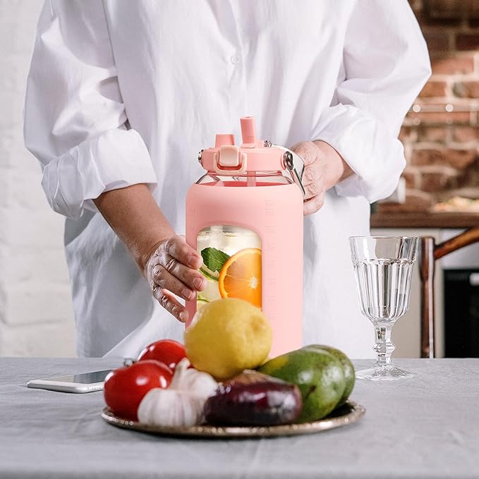 BLUEGO 84oz Water Bottle Glass with Stainless Steel Handle Large 2.5l Water Bottle with Time Markers and Silicone Sleeve Half Gallon Water Jug BPA Free for Gym Daily Use, Pink