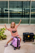 Younglingz LIL FLYER GO Version 2 Ride On Suitcase for Kids | Carry On Luggage with Toddler Seat, Foldable Handlebars, Pedals, and Removable Wheels | Holds up to 80 lbs | Glam | Ages 2-6