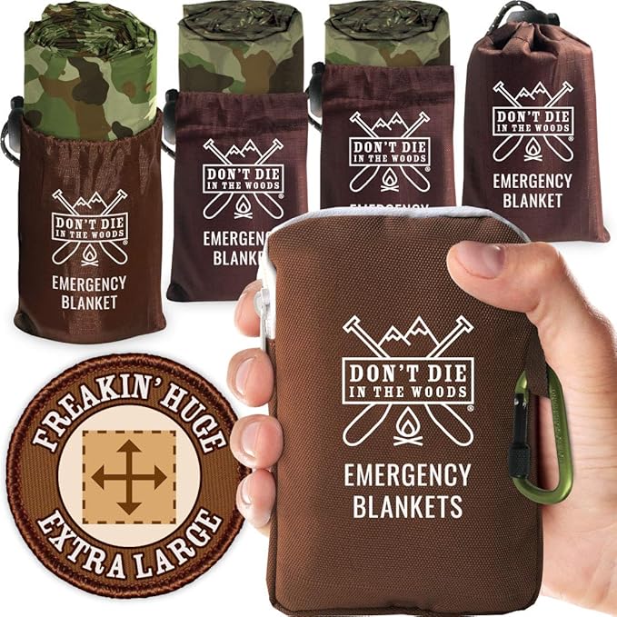 Don't Die In The Woods - Freakin’ Huge Emergency Blankets [4-Pack] Extra-Large Thermal Mylar Space Blankets with Ripstop Nylon Stuff Sacks + Carabiner Zipper Pack [Woodland Camo]