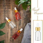 100 Pcs Mini Glass Oil Dropper Bottle Bulk, Clear Essential Small Empty Bottles Sample Containers Perfume Liquid Vials with Cap for Traveling (10 ml,Gold)